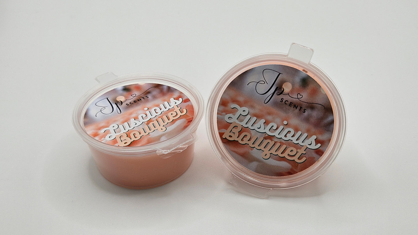 25g Shot Pot Luscious Bouquet Wax Melt showcasing vibrant peach, raspberry, and apple fruits complemented by delicate floral notes of violet, jasmine, freesia, and rose. A luxurious sweet base of vanilla, sandalwood, coconut, and musk completes this elegantly layered wax melt fragrance.